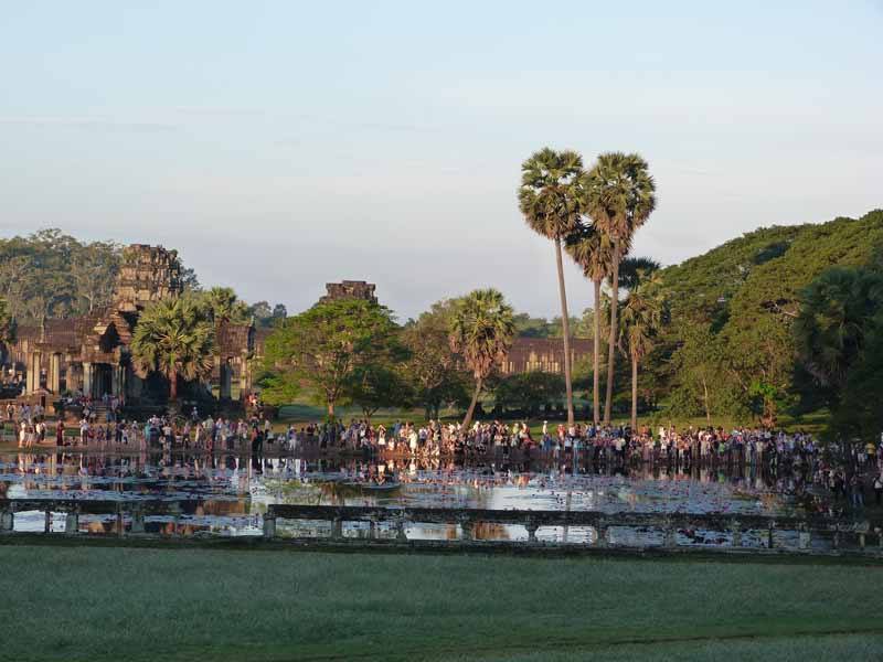 Huge crowds gather to watch the sunrise at Angkor Wat