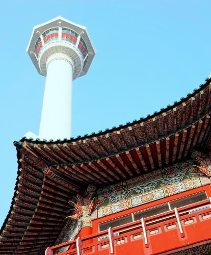 Red temple roof and Busan Tower in background