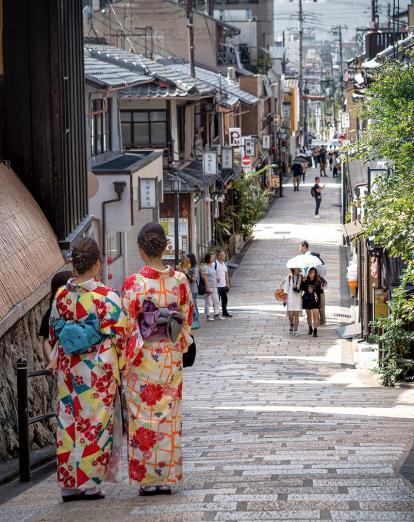Two ladies wearing kimono in streets of Kyoto