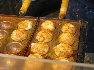 Takoyaki octopus balls cooked in trays